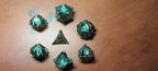 7 x Polyhedral Dice Hollow Metal Leaf Green with Silver Dice