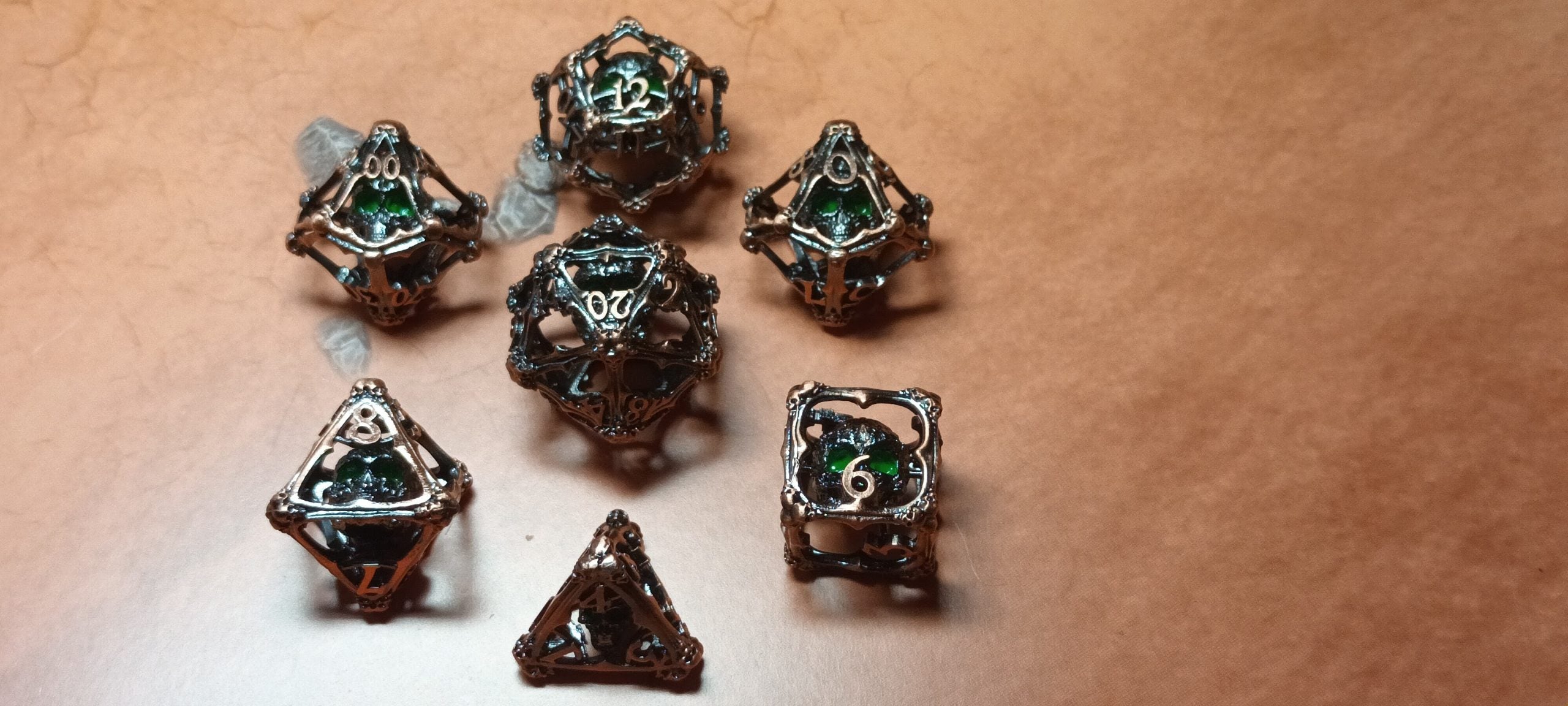 7 x Polyhedral Dice Hollow Metal Skull Silver with Green Eyes Dice