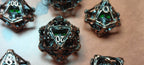 7 x Polyhedral Dice Hollow Metal Skull Silver with Green Eyes Dice