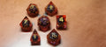 7 x Polyhedral Dice Resin Liquid Core Skull Red with Gold Dice