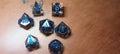 7 x Polyhedral Dice Resin Liquid Core Skull Grey with Blue Dice