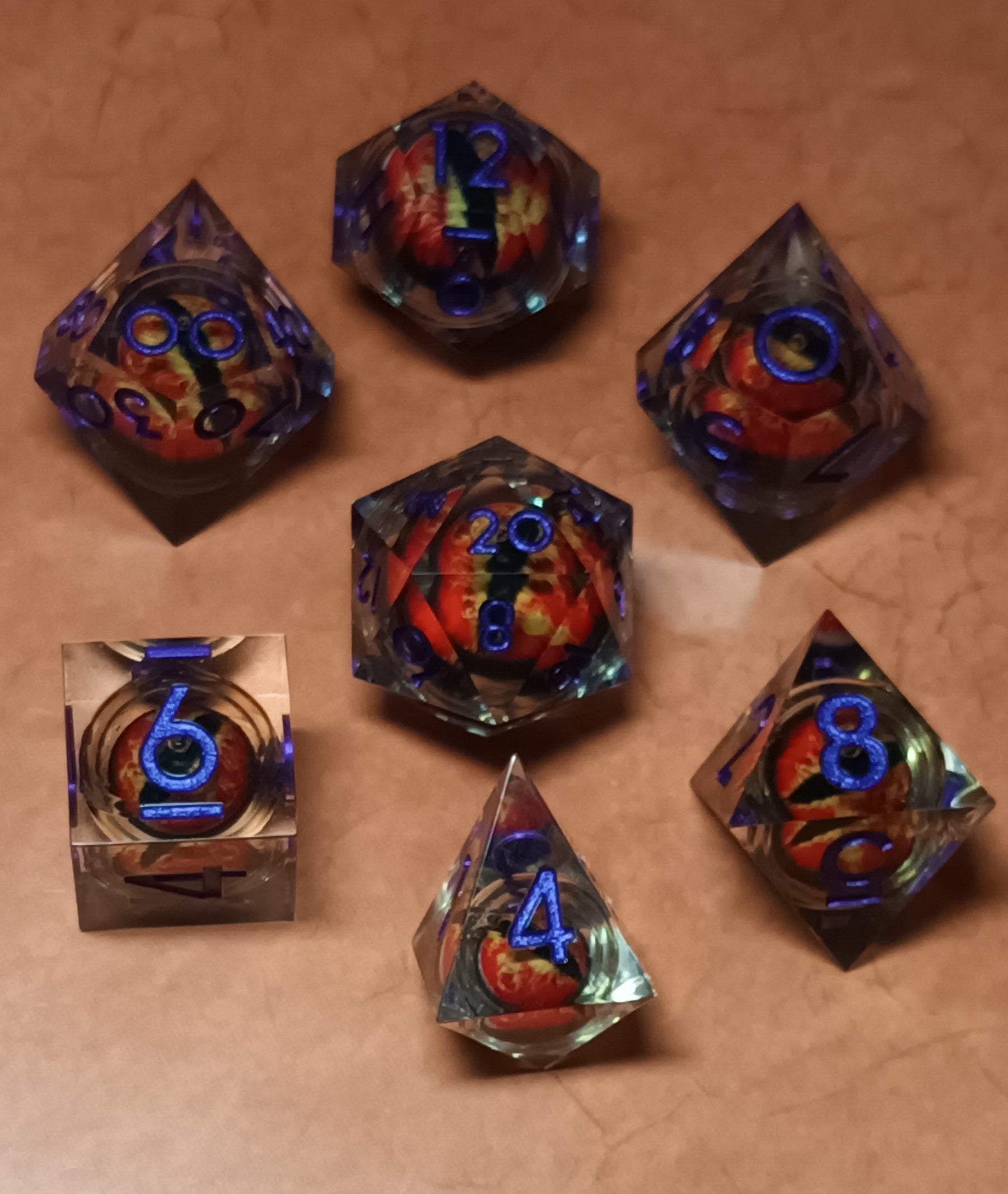7 x Polyhedral Dice Resin Liquid Core Orange Dragon Eye Clear with Blue Dice