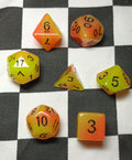 7 x Polyhedral Dice Glow in the Dark Yellow Orange with Black