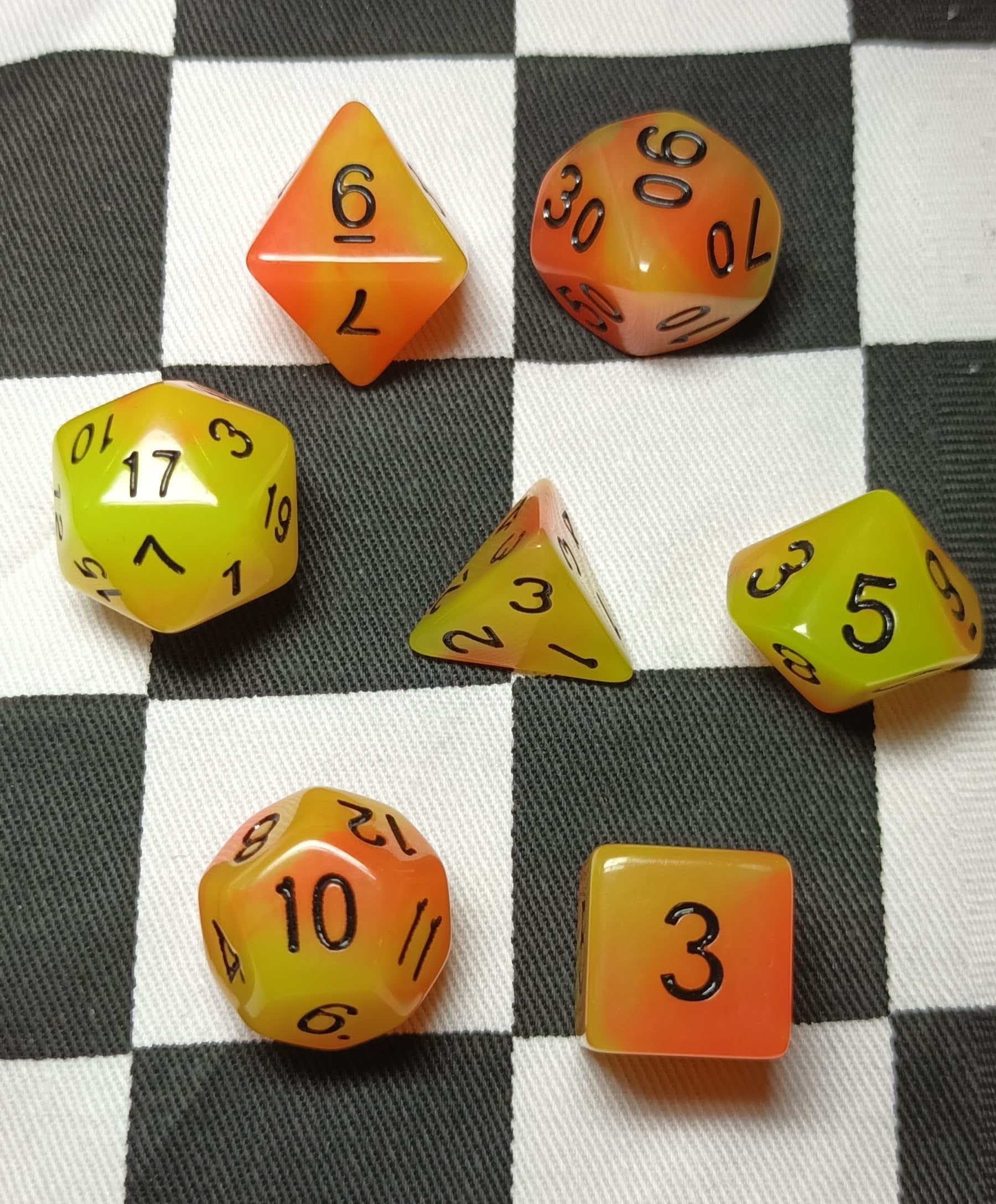 7 x Polyhedral Dice Glow in the Dark Yellow Orange with Black