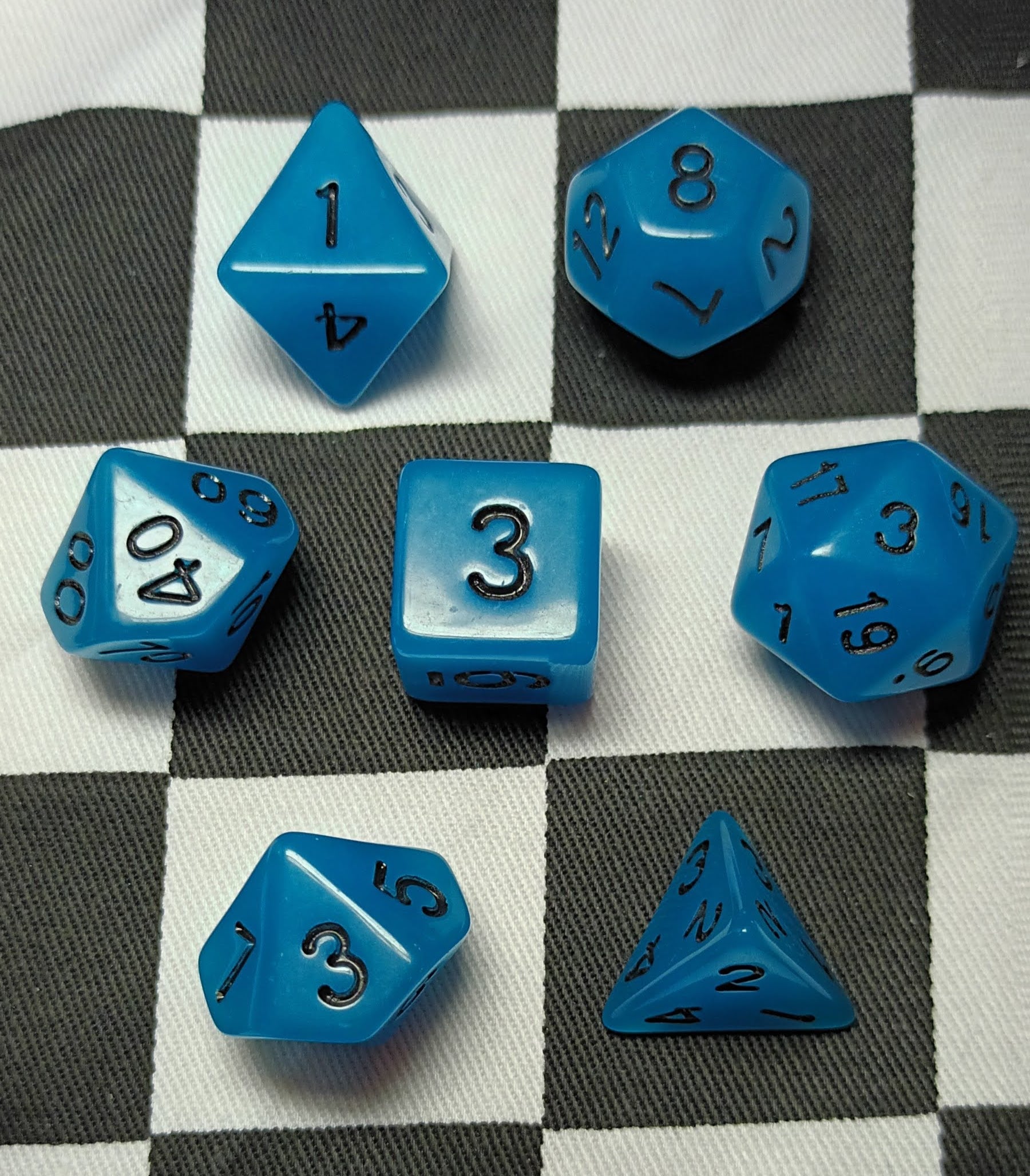 7 x Polyhedral Dice Glow in the Dark Blue with Black